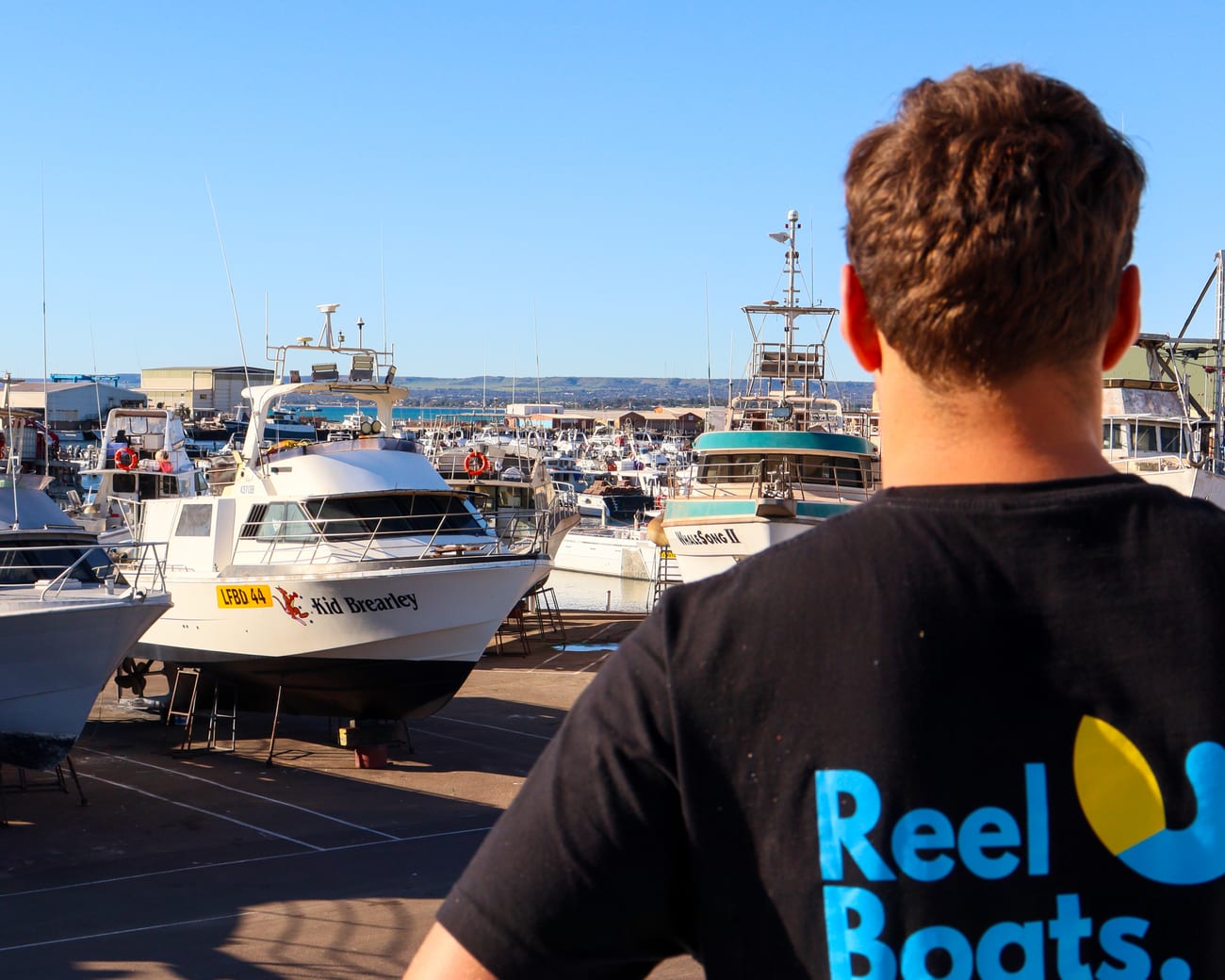 Reel Boats team looking over the boats at the Geraldton yard